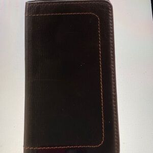 Vintage Louis Vuitton brown leather bifold wallet.